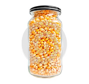 Jar of popcorn kernels isolated on white