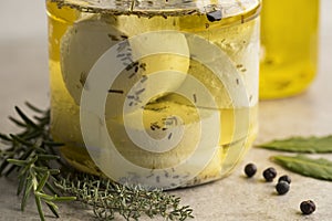 Jar with preserved white organic Dutch goat cheese