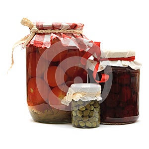 Jar with preserves. Jam, pickled tomatoes, capers