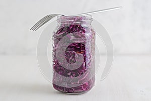 Jar with purple sauerkraut standing