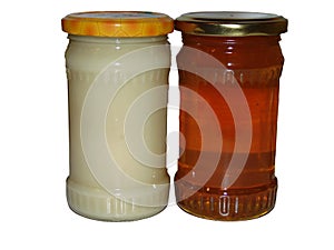 A jar of rapeseed honey and a jar of polyfloral honey