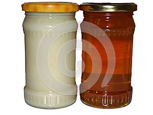 A jar of rapeseed honey and a jar of polyfloral honey