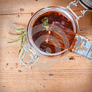 Jar of savory spicy basting sauce