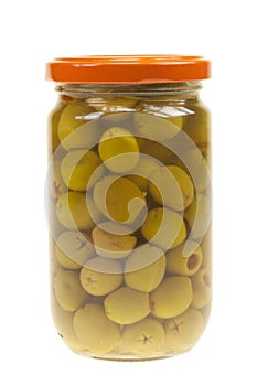 A jar of stuffed green olives isolated