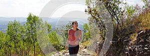 Jaragua State Park, Sao Paulo, Brazil. Panoramic banner view of young hiker woman walks Trilha do Pai Ze path in Jaragua State photo