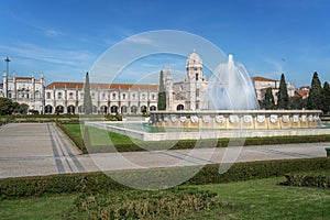 Jardim da Praca do Imperio Square with Fountain and Jeronimos Monastery - Lisbon, Portugal photo