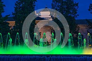 Jardines de Triunfo and fountain of color green at night, Granada, Spain photo