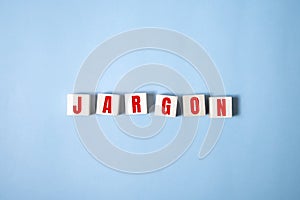 Jargon - word from wooden blocks, special words and phrases jargon concept, top view on blue background