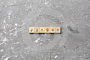 Jargon word written on wood block. Jargon text on cement table for your desing, Top view concept