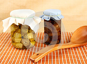 Jars with artichokes and onions in oil