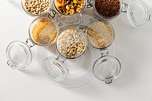 jars with cereals, pasta and beans from top