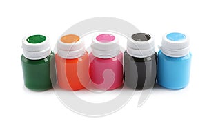 Jars with colorful paints on white background. Artistic equipment