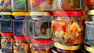 Jars of different honey varieties stocked on a shelf.