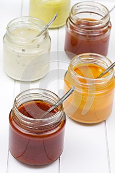 Jars filled with barbecue sauces