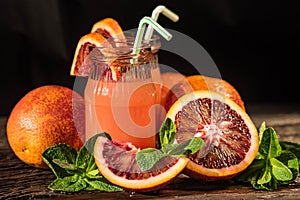 Jars of fresh blood orange juice, selective focus