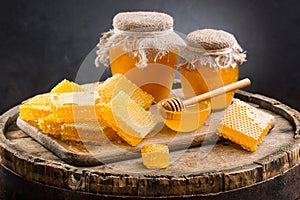 Jars of honey and honeycombs