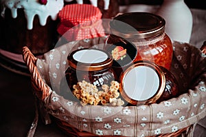 Jars of jam in a beautiful wicker basket.
