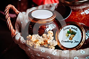 Jars of jam in a beautiful wicker basket.