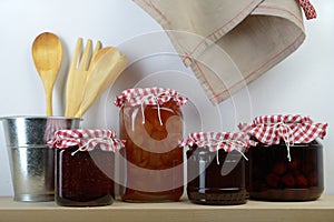 Jars with jam on a shelf