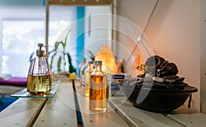 Jars with lotions and essences on a table in a therapy center