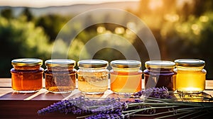 Jars of organic flower honey on a wooden table, with lavender, sunset in the background. Generative AI