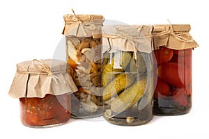 Jars with pickled vegetables. Marinated products.