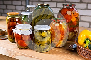 Jars of Preserved Vegetables on Wooden Table