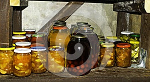 Jars with variety of pickled vegetables fruits Preserved food