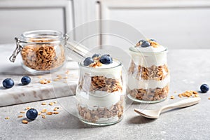 Jars with yogurt, berries and granola