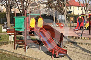 Jaslo, Poland - 9 2 2019: children`s slide for climbing in the park. Multi-colored toys for children. Equipment for active