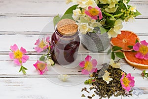 Jasmine dry green tea leaves with jasmine flowers ,with flowers of wild roses and raspberry jam