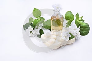 Jasmine essential oil and fresh jasmine blossom. Jasmin soap for spa and relax. Alternative medicine and natural body