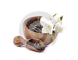 Jasmine flowers and green tea  on a white background. Green tea with jasmine. Herbal medicine