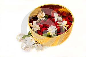 Jasmine and roses corolla in bowl on white background