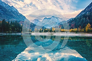 Jasna lake, Triglav national park, Kranjska Gora, Slovenia, autumn landscape, clear water and mountains, travel background