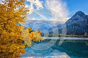 Jasna lake, Triglav national park, Kranjska Gora, Slovenia, autumn landscape, clear water and mountains, travel background