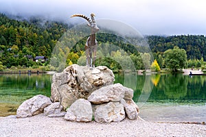 Jasna lake, Triglav national park, Kranjska Gora, Slovenia, autumn landscape, clear water and mountains, travel background