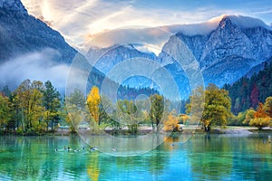 Jasna lake in Triglav national park at sunrise, Kranjska Gora, Slovenia. Amazing autumn landscape with Alps mountains