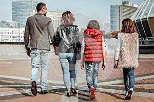 Young and active family performing a family jaunt photo