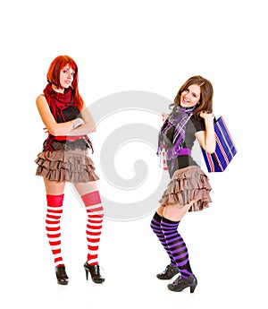 Jaunty girl with shopping bags and her girlfriend photo