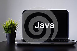 Java programming language. Programming training, the concept of computer courses. Laptop on the table