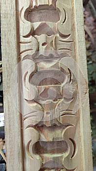 Javanese gebyok carving. Part of the pestilence photographed in Jepara at noon.