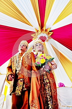 Javanesse Moslem Bride wear beskap and Groom wear batik in Traditional Wedding