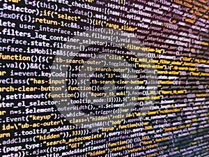 Javascript code in bracket software. Computing, cyberspace , future and innovation concept. IT coding on monitor screen. Laptop