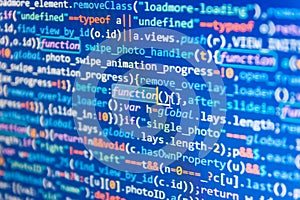 Javascript code in bracket software. Programmer typing new lines of HTML code.