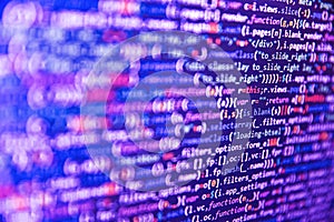 Javascript functions, variables, objects. Closeup of Web Code on Computer LED Screen. Programmer working on computer screen.