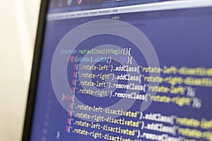 Javascript and HTML front-end source code. Laptop screen layout of web developer