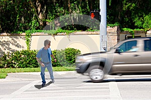 Jaywalking man about to be run over by truck