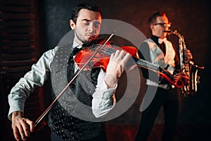 Jazz man and violinst, classical musical duet