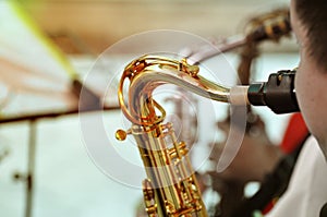 Jazz musician playing the saxophone, closeup